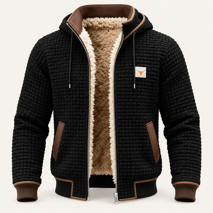 Veste rétro noire à capuche, vue de face sur fond blanc cassé.